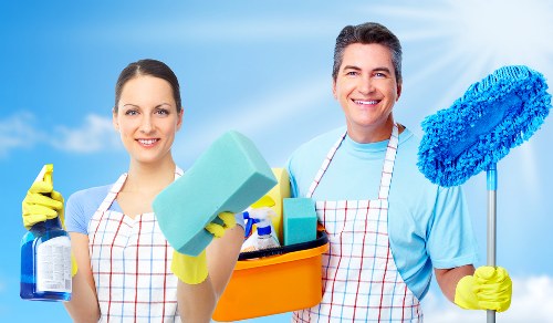 Professional carpet cleaning team following health and safety standards